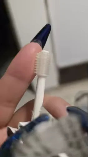 Customer showing the size of the 360 ToothBrush compared to her finger