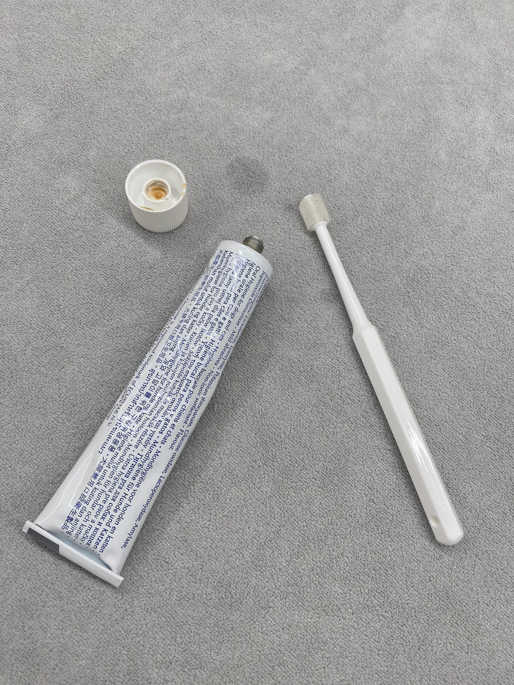 Customer applying the toothpaste on the RagRoyale 360 ToothBrush