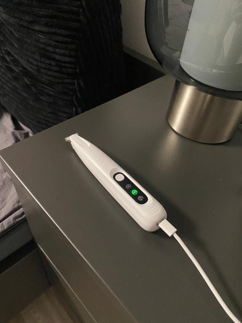 Customer charging the RagRoyale FurTrim on the table