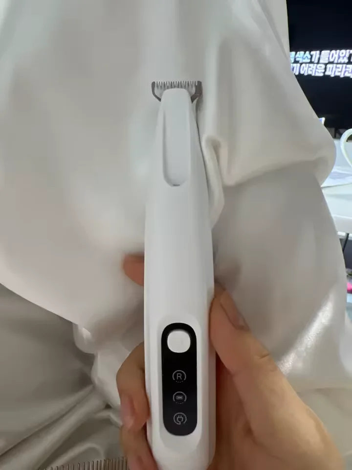Customer holding RagRoyale FurTrim before grooming his cat