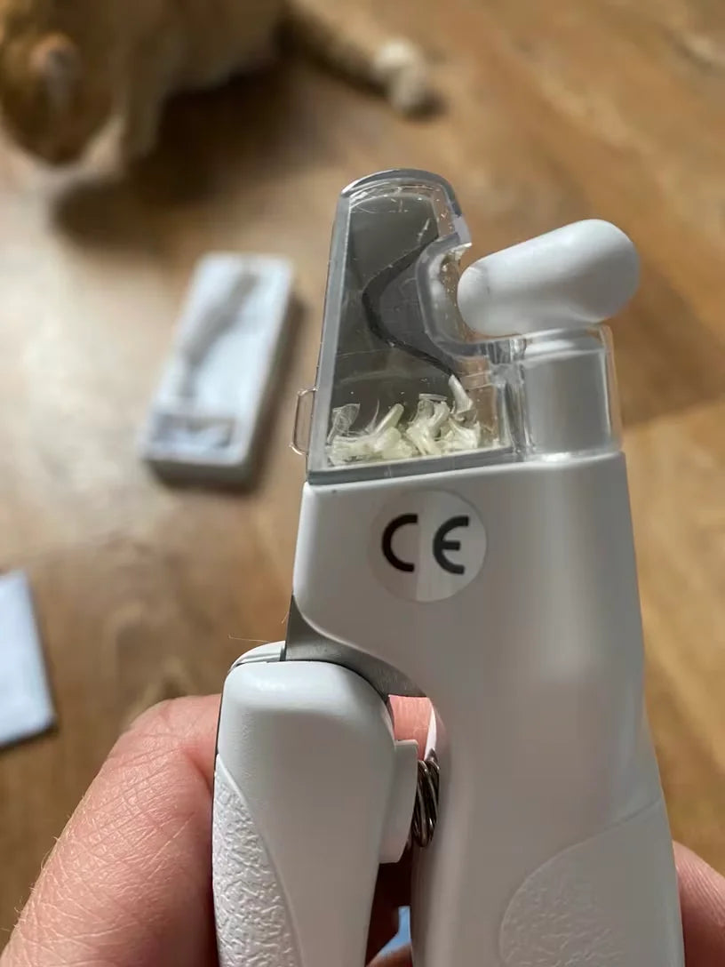 Customer showing the nail clippings of his cat in the nail clipping compartment of the LED clipper