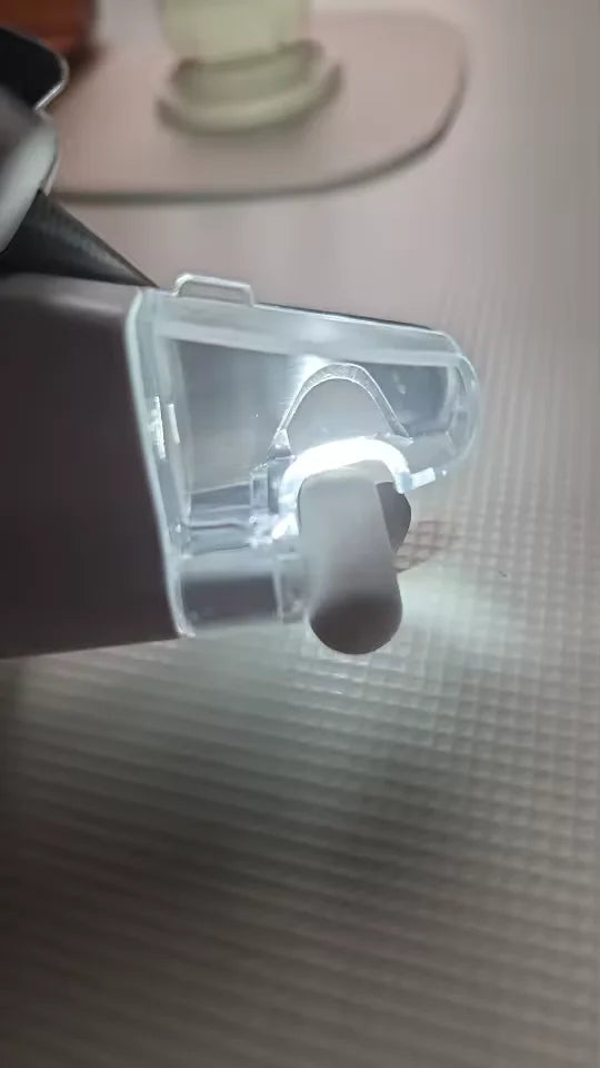 Customer showing LED clipper light before nail clipping his cats nails