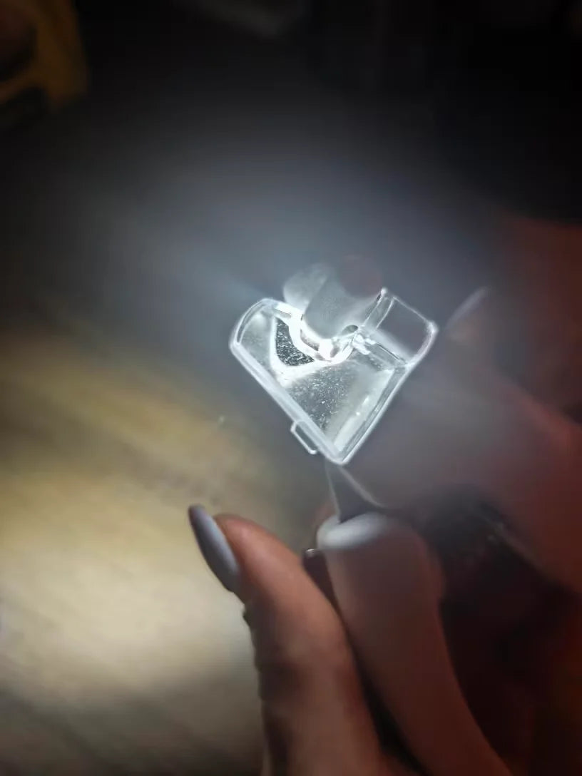Customer showing LED nail clippers light in the dark