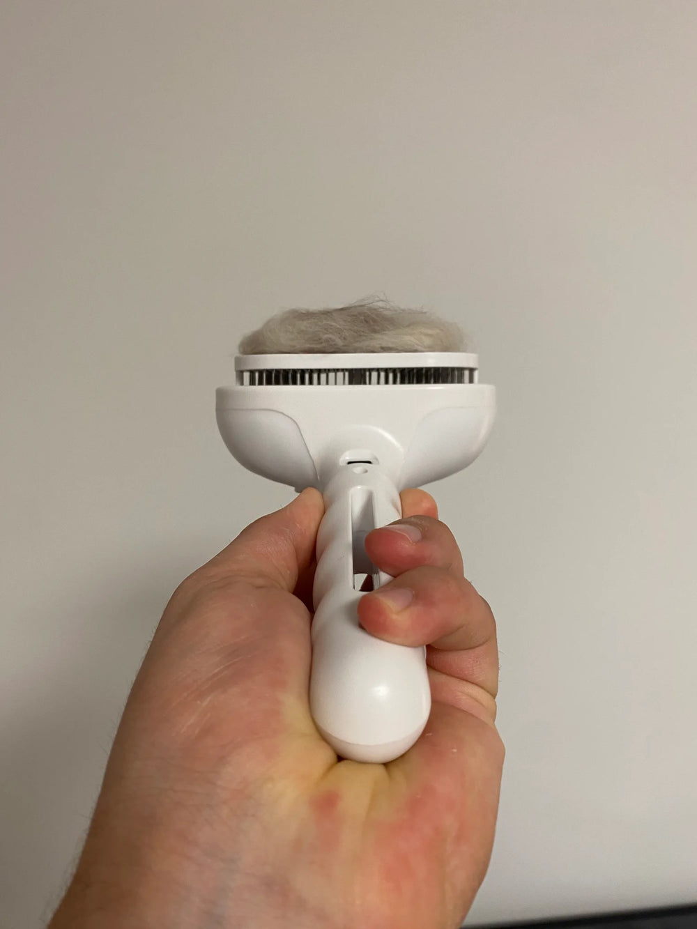 Customer showing one click cleaning feature of the Mist Brush