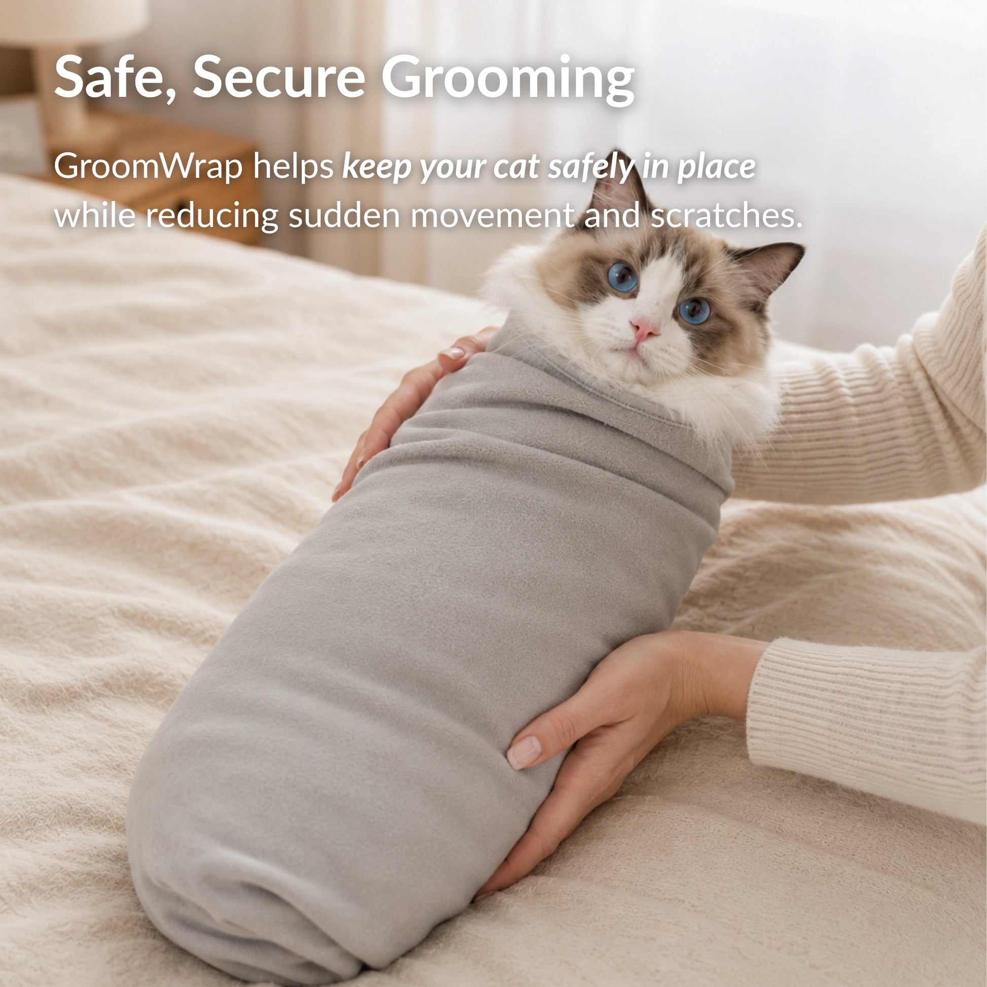 Cat comfortably secured in RagRoyale GroomWrap to help prevent scratching, sudden movement and stress during grooming