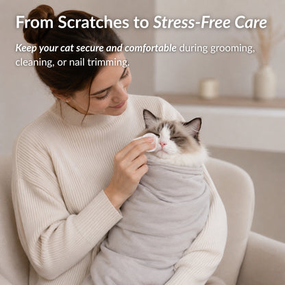 Cat secured in RagRoyale GroomWrap during grooming and cleaning for a calmer, safer and stress free grooming experience